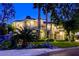 Beautiful home with lush landscaping, mature trees, and exterior stone accents at 2008 Winter Wind St, Las Vegas, NV 89134