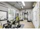 Home gym equipped with exercise equipment, weights, storage, and natural light at 2008 Winter Wind St, Las Vegas, NV 89134