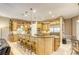 Spacious kitchen with breakfast bar, ample cabinet space, and stainless steel appliances at 2008 Winter Wind St, Las Vegas, NV 89134