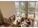 Bright living room with floor-to-ceiling windows offering natural light and views of the backyard pool at 2008 Winter Wind St, Las Vegas, NV 89134
