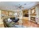 Open-concept living area features a fireplace, hardwood floors, and seamless flow into the kitchen at 2008 Winter Wind St, Las Vegas, NV 89134