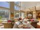 Sun-filled living room with floor to ceiling windows and access to dining room at 2008 Winter Wind St, Las Vegas, NV 89134