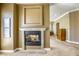 Cozy fireplace in living room, with doorway leading to another room at 2008 Winter Wind St, Las Vegas, NV 89134
