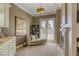 Bright living room featuring French doors, a chaise lounge, and stylish decor at 2008 Winter Wind St, Las Vegas, NV 89134