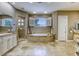 Luxurious bathroom with a standalone tub, double vanity, and glass shower at 2008 Winter Wind St, Las Vegas, NV 89134