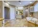 Large bathroom featuring a soaking tub, tile flooring, and separate vanities at 2008 Winter Wind St, Las Vegas, NV 89134