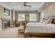 Bright main bedroom with a fireplace, comfortable seating, and two large windows at 2008 Winter Wind St, Las Vegas, NV 89134