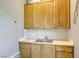 Mudroom with abundant storage, a stainless steel sink, and neutral colored walls at 2008 Winter Wind St, Las Vegas, NV 89134