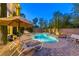Beautiful swimming pool featuring spa, waterfall, and lounge area in lush backyard at 2008 Winter Wind St, Las Vegas, NV 89134