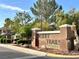 Desert Trails neighborhood entrance with desert landscaping, blue skies, and well-maintained surroundings at 2008 Winter Wind St, Las Vegas, NV 89134