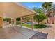Backyard features a covered patio, lush landscaping, and a beautiful pool, ideal for entertaining at 215 Sunlight Peak St, Henderson, NV 89012