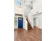 Inviting entryway featuring a staircase, blue door, and chandelier lighting at 215 Sunlight Peak St, Henderson, NV 89012