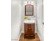Cozy powder room featuring a vanity with dark wood cabinets at 215 Sunlight Peak St, Henderson, NV 89012