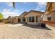Spacious backyard with a covered patio and low-maintenance gravel landscaping, perfect for outdoor entertaining at 2156 Eagle Sticks Dr, Henderson, NV 89012