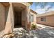 Inviting front entryway with covered porch and shade trees provides a warm greeting at 2156 Eagle Sticks Dr, Henderson, NV 89012