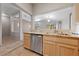 Open kitchen with stainless steel appliances, granite countertops, and a view into the adjacent living area at 2156 Eagle Sticks Dr, Henderson, NV 89012