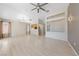 Bright living room featuring hardwood floors, neutral wall, and a modern ceiling fan at 2156 Eagle Sticks Dr, Henderson, NV 89012