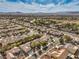 Elevated shot showcasing the neighborhood's mature trees, wide streets, and diverse housing styles under a bright sky at 2581 Terrytown Ave, Henderson, NV 89052