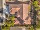 Overhead view of a home featuring a clay tile roof, manicured landscaping, and an inviting outdoor patio at 2581 Terrytown Ave, Henderson, NV 89052