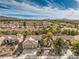 Expansive aerial view of a well-maintained single-story home with a desert landscaped yard in a lovely community at 2581 Terrytown Ave, Henderson, NV 89052