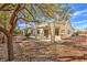 Charming backyard with desert landscaping, featuring a covered patio perfect for outdoor entertaining at 2581 Terrytown Ave, Henderson, NV 89052