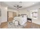 Airy main bedroom provides plenty of natural light, has access to the rear patio, and features an en suite bathroom at 2581 Terrytown Ave, Henderson, NV 89052