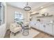 Cozy sitting area features a modern chandelier and custom white brick shelving at 2581 Terrytown Ave, Henderson, NV 89052