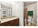 Cozy bathroom showcasing granite counters and a glimpse into the toilet and bath area at 2606 S Durango Dr # 276, Las Vegas, NV 89117