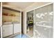 Convenient laundry area with a washer, dryer, and nearby access to the living area at 2606 S Durango Dr # 276, Las Vegas, NV 89117