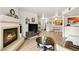 Spacious living room featuring fireplace, vinyl flooring, and an open layout to dining area at 2606 S Durango Dr # 276, Las Vegas, NV 89117