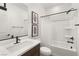 Clean bathroom featuring modern fixtures, a shower-tub combo, and neutral finishes at 2624 Stanhurst Ave, North Las Vegas, NV 89081