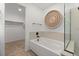 Relaxing bathroom with a sleek soaking tub and separate glass-enclosed shower at 2624 Stanhurst Ave, North Las Vegas, NV 89081