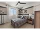 Well-designed bedroom with a stylish headboard, unique light fixtures, and a comfortable bed and desk at 2624 Stanhurst Ave, North Las Vegas, NV 89081