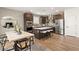 Stylish kitchen featuring a center island with seating, stainless steel appliances, and sleek lighting at 2624 Stanhurst Ave, North Las Vegas, NV 89081