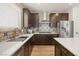 Updated kitchen showcasing stainless steel appliances, custom backsplash, and a functional layout at 2624 Stanhurst Ave, North Las Vegas, NV 89081