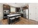 Well-appointed kitchen with stainless steel appliances, decorative backsplash, and a center island at 2624 Stanhurst Ave, North Las Vegas, NV 89081