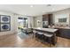 Bright kitchen boasting hardwood floors, stainless steel appliances, and a dining area at 2624 Stanhurst Ave, North Las Vegas, NV 89081