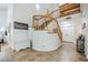 Bright foyer with curved staircase and tile flooring, offering a grand entrance at 271 Sunshine Springs Ct, Henderson, NV 89014
