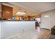 Eat-in kitchen featuring tile floors, breakfast bar, stainless appliances, and abundant sunlight at 271 Sunshine Springs Ct, Henderson, NV 89014
