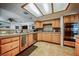 Functional kitchen with stainless steel appliances and light wood cabinets, offering ample storage and workspace at 271 Sunshine Springs Ct, Henderson, NV 89014