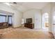 Spacious main bedroom featuring plush carpeting, large windows, and ample natural light at 271 Sunshine Springs Ct, Henderson, NV 89014