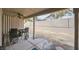 Covered patio area with a table, chairs, ceiling fan, and view of the backyard and surrounding landscape at 271 Sunshine Springs Ct, Henderson, NV 89014