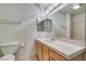 Bright bathroom featuring a large mirror, vanity with cabinets, and a toilet at 2851 S Valley View Blvd # 1161, Las Vegas, NV 89102