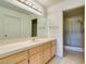 Well-lit bathroom featuring a large mirror, vanity with cabinets, and a tiled shower at 2851 S Valley View Blvd # 1161, Las Vegas, NV 89102