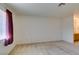 Bright bedroom featuring a window with sunlight, neutral carpet, and ample space at 2851 S Valley View Blvd # 1161, Las Vegas, NV 89102