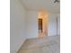 Spacious bedroom featuring neutral carpet, crisp white walls, and an adjacent bathroom, offering a blank canvas at 2851 S Valley View Blvd # 1161, Las Vegas, NV 89102