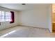 Bright bedroom featuring a window with sunlight, neutral carpet, and ample space at 2851 S Valley View Blvd # 1161, Las Vegas, NV 89102
