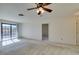 Bright, open bedroom featuring neutral carpet and a glass sliding door at 2851 S Valley View Blvd # 1161, Las Vegas, NV 89102