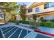 Exterior view showcasing the well-maintained building facade with lush landscaping and convenient parking at 2851 S Valley View Blvd # 1161, Las Vegas, NV 89102