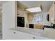 Bright kitchen with breakfast bar and black appliances at 2851 S Valley View Blvd # 1161, Las Vegas, NV 89102